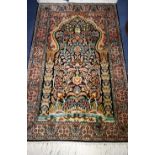 A Kashan print silk rug 124cm x 79cm