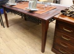 A Spanish style hardwood dining table with decorative wrought iron frieze W.166cm