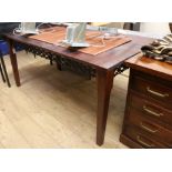 A Spanish style hardwood dining table with decorative wrought iron frieze W.166cm