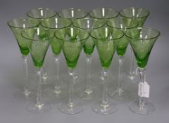 Twelve etched green and clear glass wines