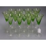 Twelve etched green and clear glass wines