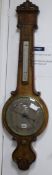 Dan Robinson, Bradford. A Victorian walnut wheel barometer W.32cm