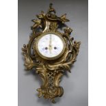 A gilt metal Cartel clock Height 51cm