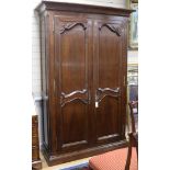 A Louis XV style walnut two door enclosed bookcase W.140cm