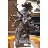 A bronze group of a man and a stallion height 64cm