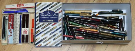 A collection of pens, books on pens and a Bonham's catalogue