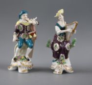 A pair of Samson porcelain figures of musicians, he playing the fife and drum, she the harp,