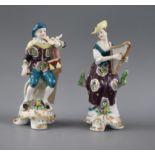 A pair of Samson porcelain figures of musicians, he playing the fife and drum, she the harp,