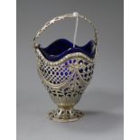 A late Victorian pierced silver sugar basket with blue glass liner, John Henry Rawlings, London,