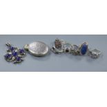 A Victorian engraved white metal locket, a silver and lapis lazuli pendant and six silver rings (8)