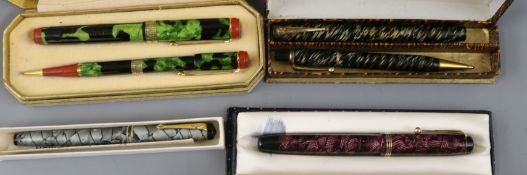A collection of boxed fountain pens, etc.