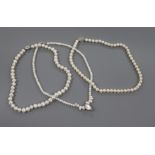 Three assorted single strand cultured pearl necklaces with 925 clasps.
