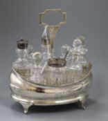 A Georgian silver cruet stand with eight associated bottles and later plated? handle, 25cm.