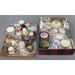 A quantity of miniature porcelain pin boxes, etc.