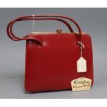 A Waldy bag, a red leather bag and purse in original box