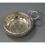 An early 19th century French white metal taste vin with ring handle and inset coin base, 11.2cm inc.