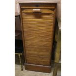 An oak tambour filing cabinet W.51cm