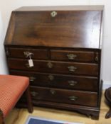 A George III oak bureau with fitted interior W.94cm