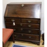 A George III oak bureau with fitted interior W.94cm