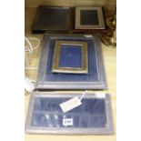 A silver photograph frame and four others