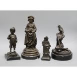 Three bronze figures of a boy and two girls and a spelter figure tallest 27cm