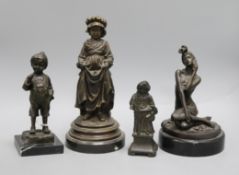 Three bronze figures of a boy and two girls and a spelter figure tallest 27cm