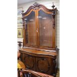 An impressive Victorian mahogany bookcase cabinet W.144cm