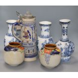 A pair of Doulton stoneware jars, three Delft vases and a large German stein