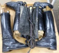 Two pairs of riding boots and trees and a stag antler handled riding crop