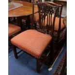 A set of twenty four Chippendale style dining chairs