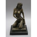 A bronze figure of a kneeling female nude height 30cm