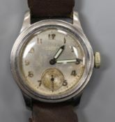 A mid 20th century stainless steel Longines mid size? manual wind wrist watch retailed by J.W.