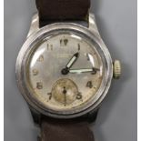 A mid 20th century stainless steel Longines mid size? manual wind wrist watch retailed by J.W.