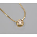 An 18ct gold and solitaire diamond pendant necklace, 40cm.