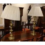 A pair of large brass lamps height 78cm excl. fittings