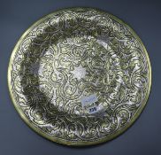 An Islamic white metal and brass charger diameter 45cm