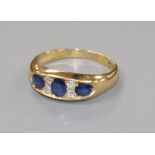 A late Victorian 18ct gold, sapphire and diamond ring, size M.