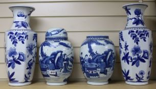 A pair of Chinese blue and white jars and cover and a pair of blue and white vases