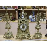 A gilt brass and enamel clock garniture Tallest piece measures 15cm