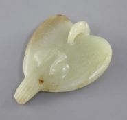 A Chinese yellow and russet jade carving of a falcon, Eastern Zhou dynasty or later, the stylised