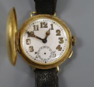 A gentleman's early 20th century 18ct gold half hunter wrist watch.