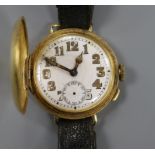 A gentleman's early 20th century 18ct gold half hunter wrist watch.