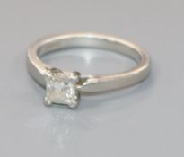 A platinum and solitaire princess cut diamond ring, size K.