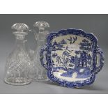 A Victorian blue and white dish and two cut glass decanters