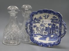 A Victorian blue and white dish and two cut glass decanters