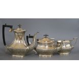 A three piece silver plated tea and coffee set, with half fluted bodies