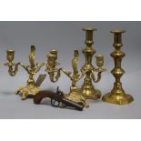 A pair of brass candelabra, a pair of brass candlesticks and a percussion pistol