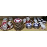 A Bohemian crimson ground tea set and an Imari pattern part coffee set, two chocolate cups and a