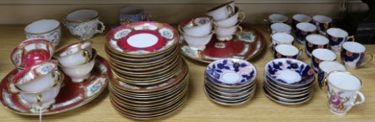 A Bohemian crimson ground tea set and an Imari pattern part coffee set, two chocolate cups and a