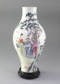 A Chinese famille rose baluster shaped vase, 20th century, finely painted with scholars and